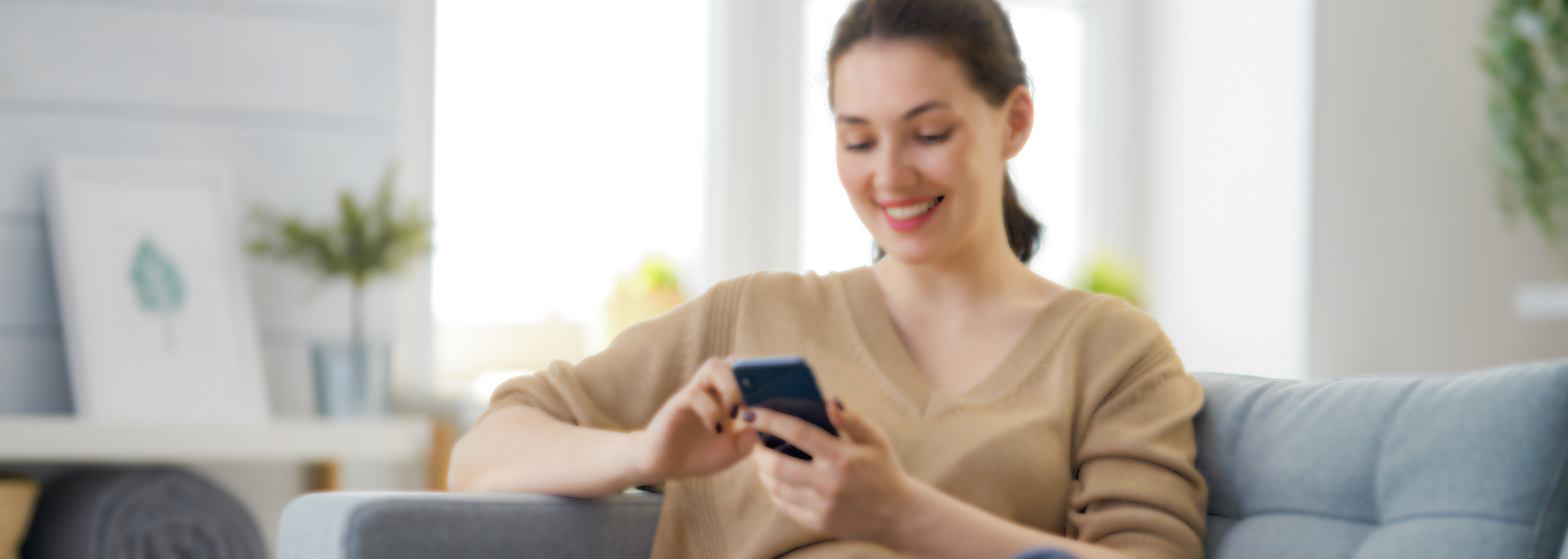 woman on phone on couch